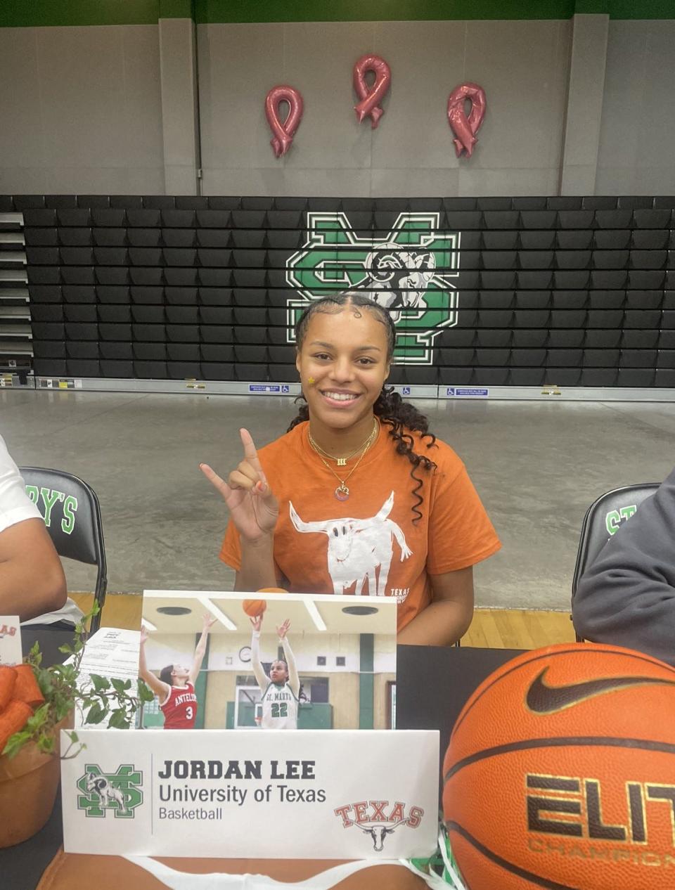 Jordan Lee makes her choice known in a signing day ceremony Wednesday at her school.