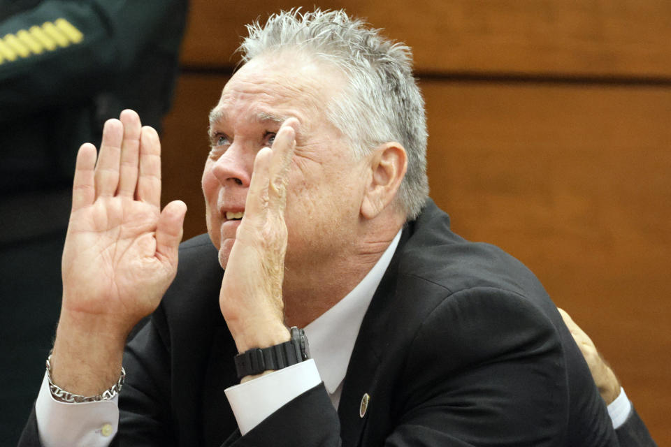 Former Marjory Stoneman Douglas High School School Resource Officer Scot Peterson reacts as he is found not guilty on all charges at the Broward County Courthouse in Fort Lauderdale, Fla., on Thursday, June 29, 2023. Peterson was acquitted of child neglect and other charges for failing to act during the Parkland school massacre, where 14 students and three staff members were murdered. (Amy Beth Bennett/South Florida Sun-Sentinel via AP, Pool)