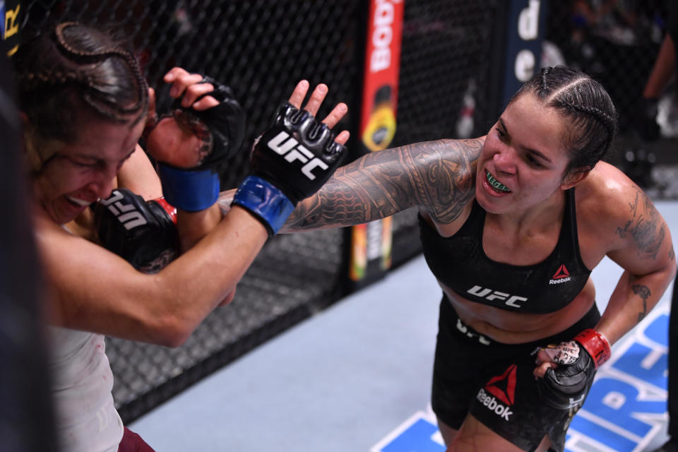 LAS VEGAS, NEVADA - JUNE 06: (R-L) Amanda Nunes of Brazil punches Felicia Spencer of Canada in their UFC featherweight championship bout during the UFC 250 event at UFC APEX on June 06, 2020 in Las Vegas, Nevada. (Photo by Jeff Bottari/Zuffa LLC)