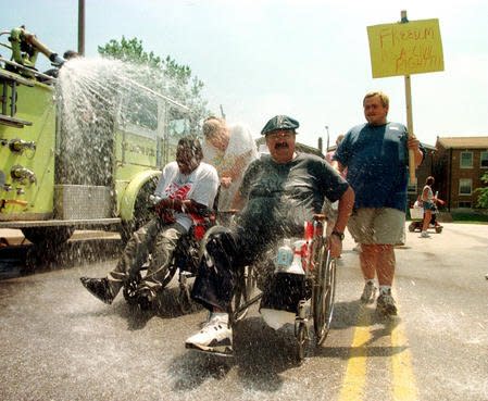 Participants march in the Heartland Disability Rights March and Rally on July 25, 1999, to celebrate the signing of the Americans With Disabilities Act of July 26, 1994. File Photo by Bill Greenblatt/UPI