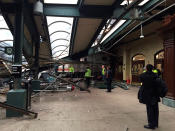 <p>A New Jersey Transit train that derailed and crashed through the station is seen in Hoboken. (Photo courtesy of Corey Futterman, via Reuters) </p>