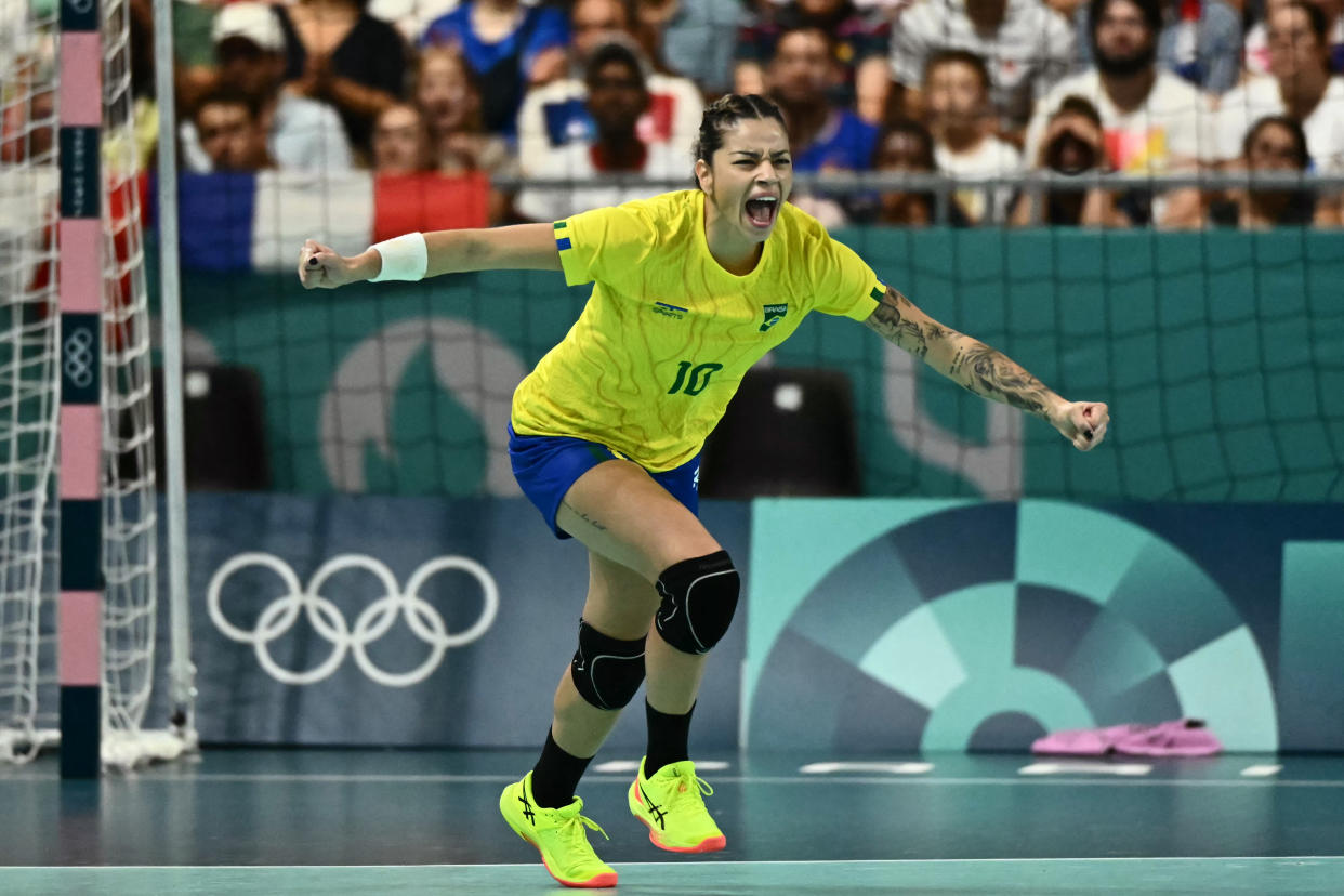 Brazil's right wing #10 Jessica Quintino celebrates after scoring during the Women's Preliminary Round Group B handball match between France and Brazil of the Paris 2024 Olympic Games, at the Paris South Arena in Paris, on July 30, 2024. (Photo by Aris MESSINIS / AFP)