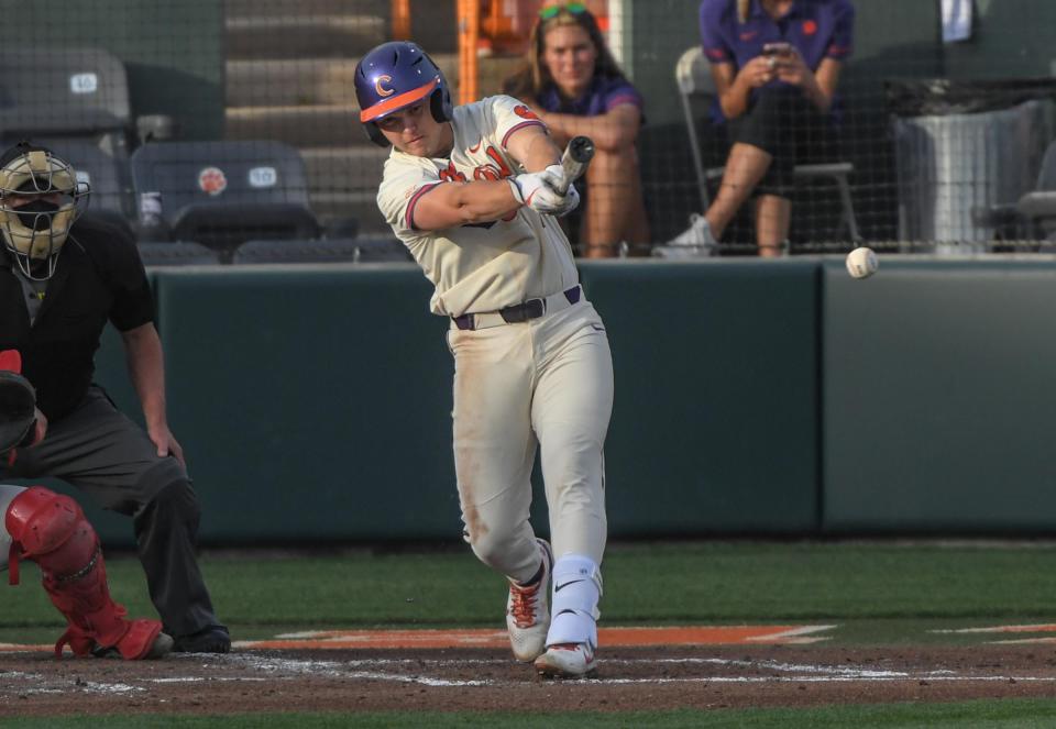 Clemson baseball's Max Wagner hits a ball during the bottom of the second inning at Doug Kingsmore Stadium in Clemson Tuesday, March 30, 2021.