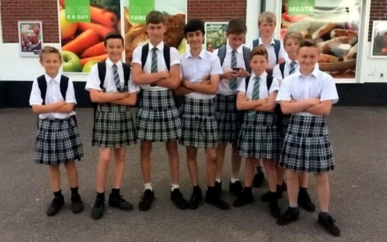 Boys at ISCA College in Exeter, Devon arrive for school wearing skirts after they were banned from wearing shorts - Devon Live / SWNS.com