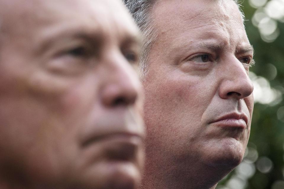 New York Mayoral candidate Bill de Blasio (R) stands near New York Mayor Michael Bloomberg during the 9/11 Memorial ceremonies marking the 12th anniversary of the 9/11 attacks on the World Trade Center in New York on September 11, 2013. REUTERS/Adrees Latif (UNITED STATES - Tags: DISASTER ANNIVERSARY TPX IMAGES OF THE DAY)