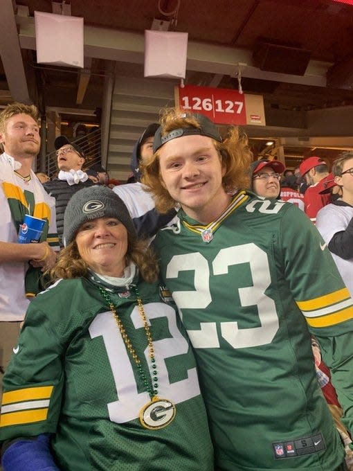 Norman Gratz (right) poses with his mom, Becky, at the Packers game against the San Francisco 49ers on Sept. 26, 2011, at Levi's Stadium. Gratz's post to Twitter right after San Francisco took a late lead went viral when Green Bay stormed back to win.