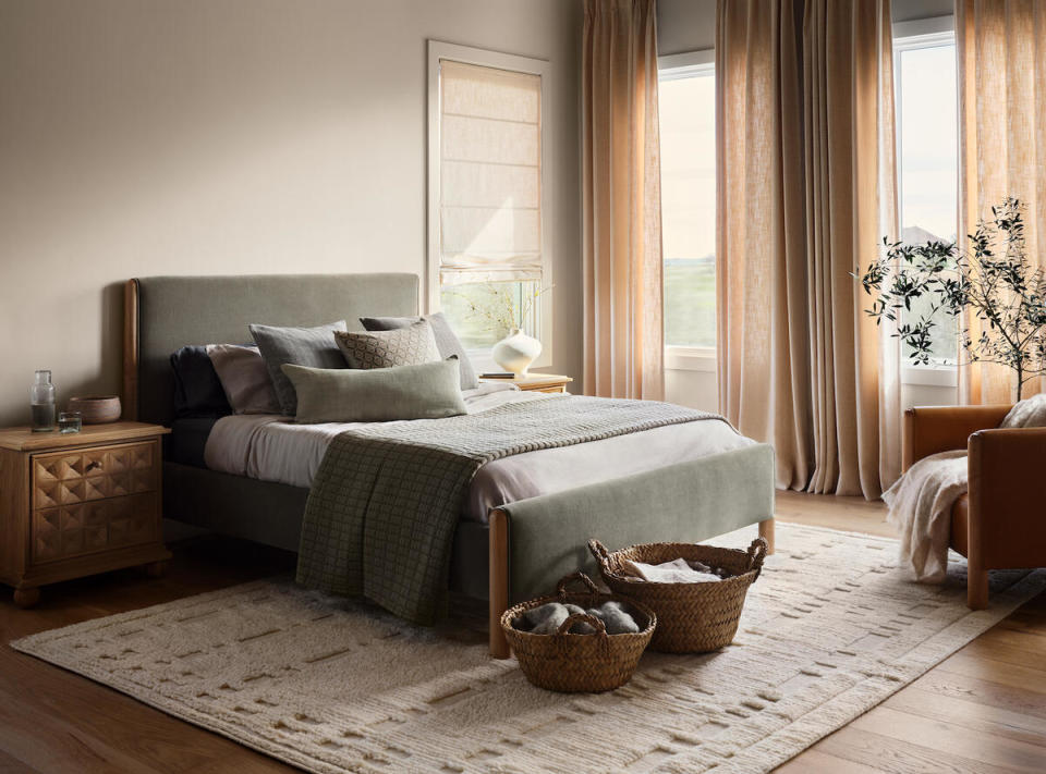 The Citizenry’s Jaya nightstand and stonewashed linen bedding in Seaglass 