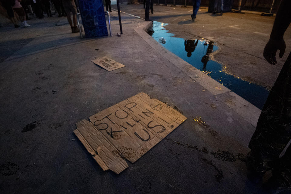 Signs are seen on the floor after clashes erupt following the intervention of security forces in a protest against police brutality at the Tribunal de Paris courthouse on June 2. | Julien Benjamin Guillaume Mattia—Anadolu Agency/Getty Images