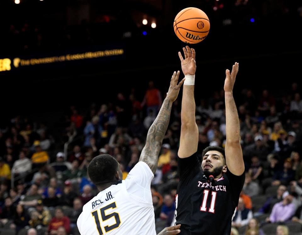 Texas Tech's forward Fardaws Aimaq (11) shoots the ball against West Virginia in the first round of the Big 12 basketball tournament, Wednesday, March 8, 2023, at T-Mobile Center in Kansas City, Mo. 