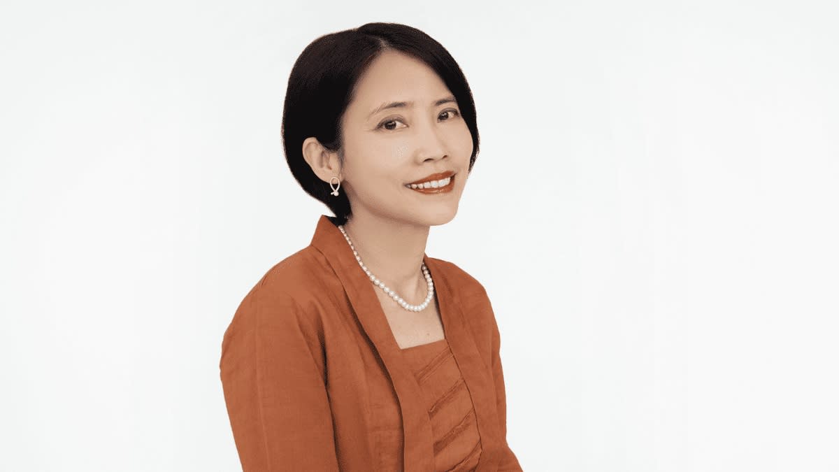 Helen Wong, managing partner at AC Ventures, in a brick orange blazer and pearls, illustrating a story on Forbes 50 Over 50 list.
