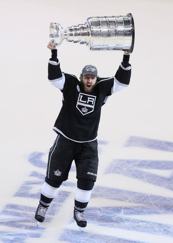 LOS ANGELES, CA - JUNE 11: Mike Richards #10 of the Los Angeles Kings holds up the Stanley Cup after the Kings defeated the New Jersey Devils 6-1 to win the Stanley Cup series 4-2 after Game Six of the 2012 Stanley Cup Final at Staples Center on June 11, 2012 in Los Angeles, California. (Photo by Jeff Gross/Getty Images)