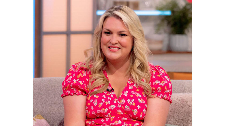 Sara Davies smiles as she sits on sofa on Lorraine