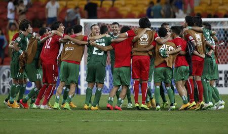 Iraq players celebrate their victory over Jordan after their Asian Cup Group D soccer match at the Brisbane Stadium in Brisbane January 12, 2015. REUTERS/Edgar Su