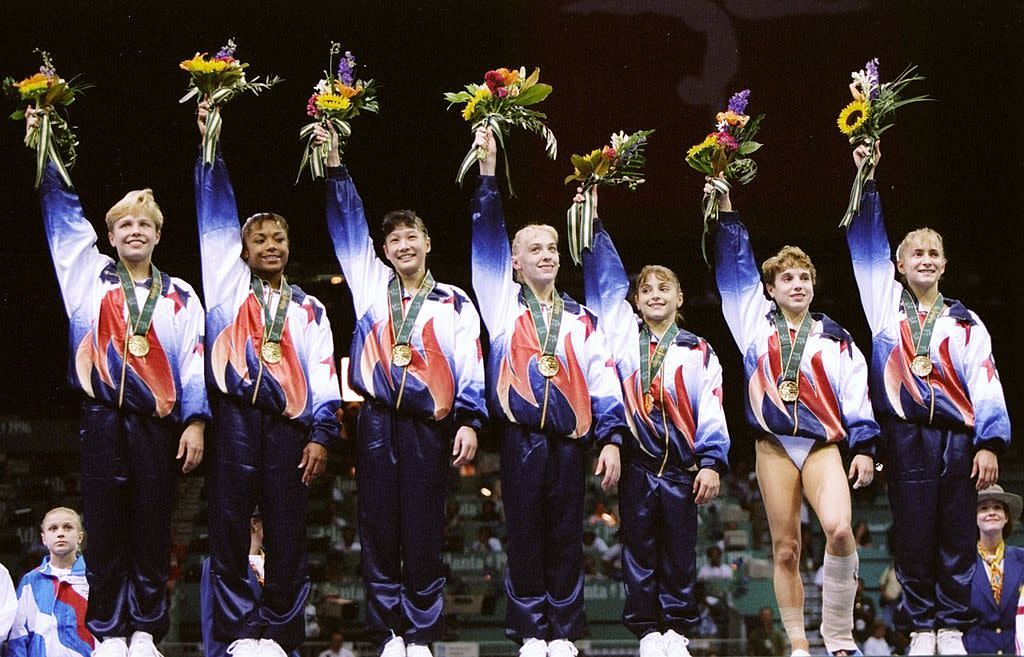 The "Magnificent Seven" female gymnasts from the 1996 Olympics have become more magnificent in the past 20 years. (Photo: Getty)