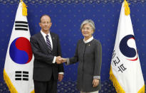 South Korean Foreign Minister Kang Kyung-wha, right, shakes hands with David Stilwell, U.S Assistant Secretary of State for the Bureau of East Asian and Pacific Affairs, during a meeting at the foreign ministry in Seoul, South Korea, Wednesday, July 17, 2019. (AP Photo/Ahn Young-joon. Pool)