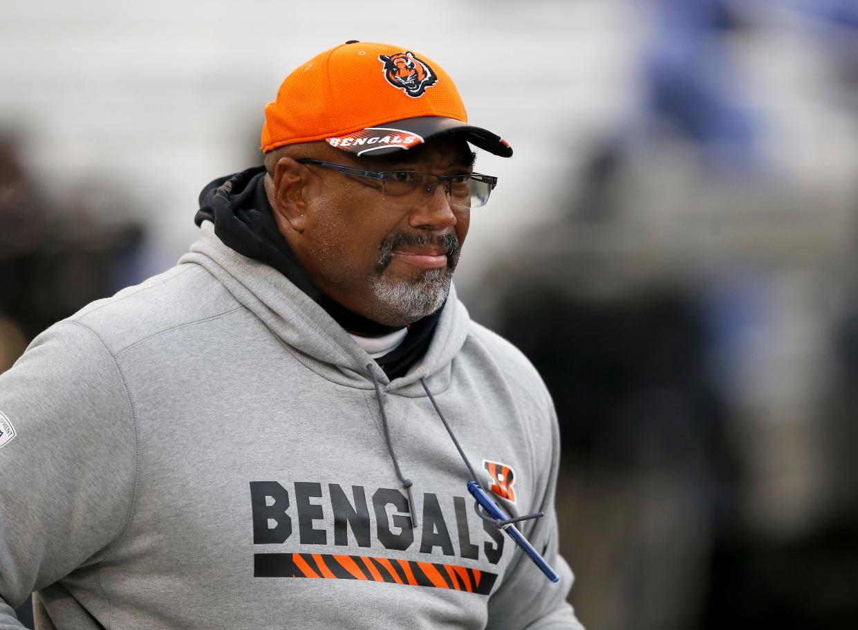 Cincinnati Bengals tight ends coach Jonathan Hayes takes the field before the first quarter of the NFL Week 17 game between the Baltimore Ravens and the Cincinnati Bengals at M&T Bank Stadium in Baltimore on Sunday, Dec. 31, 2017. At halftime the Bengals led 17-10.