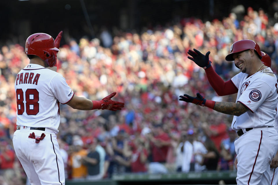 Washington Nationals' Gerardo Parra (88) celebrates his grand slam with Asdrubal Cabrera, right, during the second inning of a baseball game against the Cleveland Indians, Saturday, Sept. 28, 2019, in Washington. (AP Photo/Nick Wass)