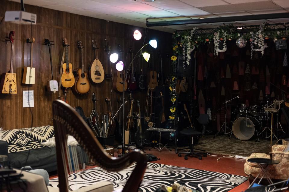 Rabbit Hole Studios, a music and arts community center where artists of all backgrounds can gather to rehearse, record and hold events, is decorated with art and instruments on Monday, Aug. 1, 2022 in Athens.