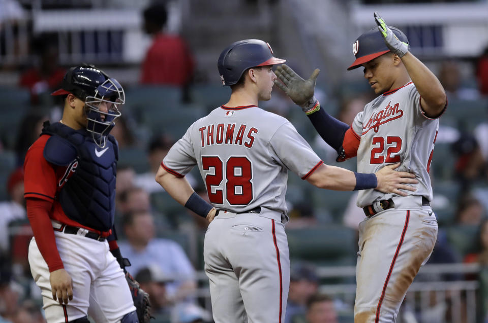 Washington Nationals' Juan Soto, right, celebrates with Lane Thomas (28) after hitting a two-run home run against the Atlanta Braves during the third inning of a baseball game Friday, July 8, 2022, in Atlanta. (AP Photo/Ben Margot)