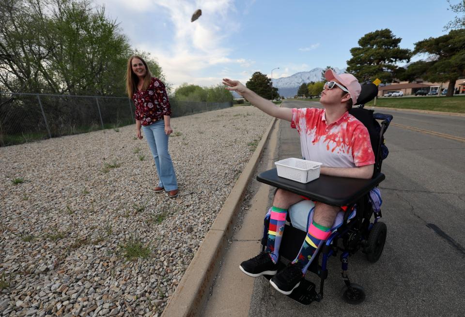 Jennifer May watches her son Stockton, 21, throw rocks while visiting him at the Utah State Developmental Center, where he lives in American Fork on Monday, May 1, 2023. Stockton has Dravet syndrome, a severe form of epilepsy. | Kristin Murphy, Deseret News