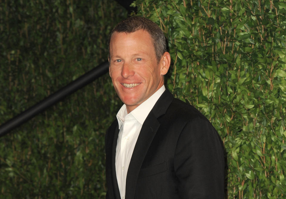 FILE - In this Feb. 26, 2012 file photo, Lance Armstrong arrives at the 2012 Vanity Fair Oscar Party Hosted By Graydon Carter held at Sunset Tower, in West Hollywood, Calif. Paramount Pictures and J.J. Abrams' production company, Bad Robot, are planning a biopic about the disgraced cyclist, a studio spokesperson said Friday, Jan. 18, 2013. (Photo by Jordan Strauss/Invision/AP Images, File)