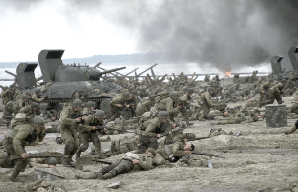 Soldiers storming the beaches of Normandy