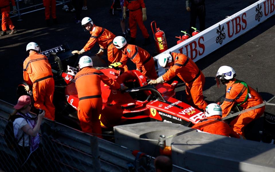 Marshals remove Ferrari's Carlos Sainz Jr.'s car of the race track during practice - Reuters/Stephane Mahe