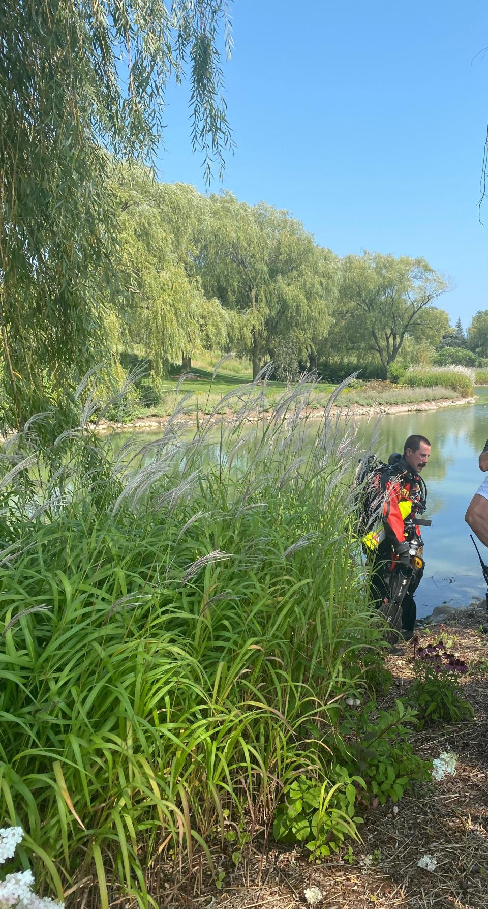 Scene at Acuity Insurance in Sheboygan after a man drove his vehicle off Interstate 43 and into a retention pond on the property Wednesday, Aug. 23, 2023.