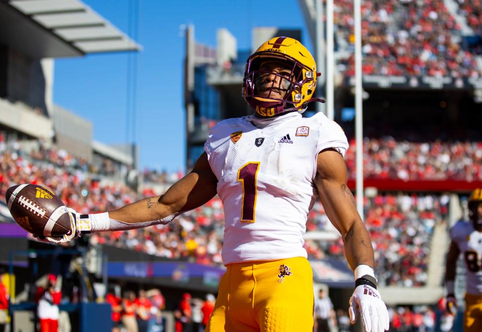 Arizona State Sun Devils running back Xazavian Valladay (1) celebrates a touchdown against the Arizona Wildcats in the first half of the Territorial Cup at Arizona Stadium.