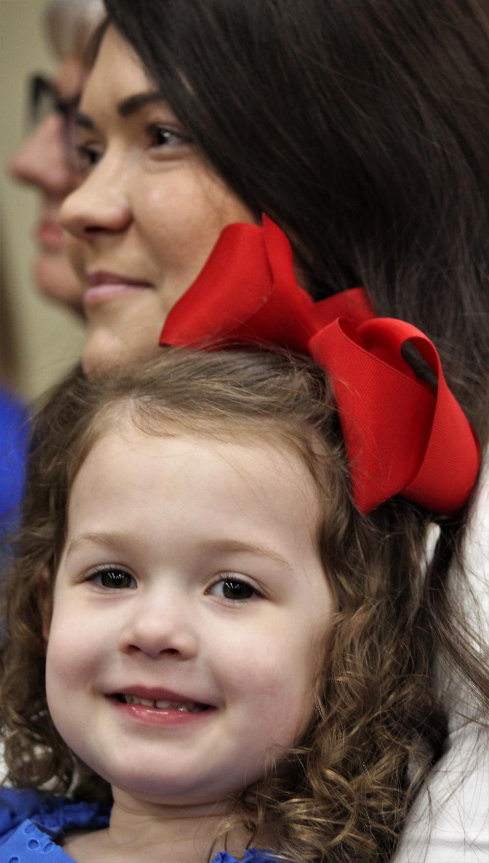 Hailey Bacon, 3, and her mother, Sarah, attended the Tuesday's media meet at which Michael Bacon was announced as boys head basketball coach at Cooper High School. April 11 2023