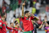 Morocco's Achraf Hakimi celebrates his team victory at the end of the World Cup round of 16 soccer match between Morocco and Spain, at the Education City Stadium in Al Rayyan, Qatar, Tuesday, Dec. 6, 2022. (AP Photo/Martin Meissner)