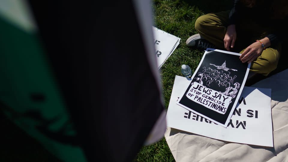 Jewish peace activists carried placards and handed out fliers denouncing Israeli airstrikes in Gaza. - Will Oliver/EPA-EFE/Shutterstock