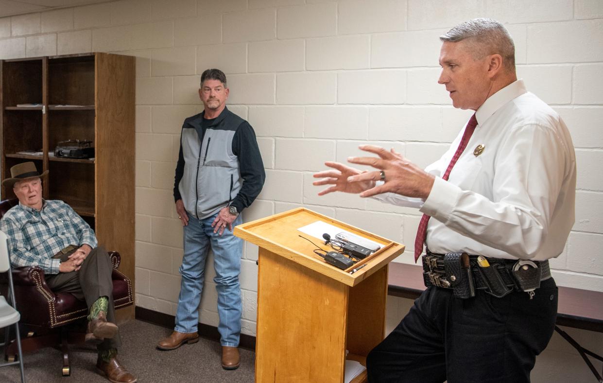 Clay County Sheriff Jeffrey Lyde answered media questions during a press conference on the afternoon of Dec. 7, 2021. His lawyer, Randall Moore, standing, listens to the sheriff's remarks.