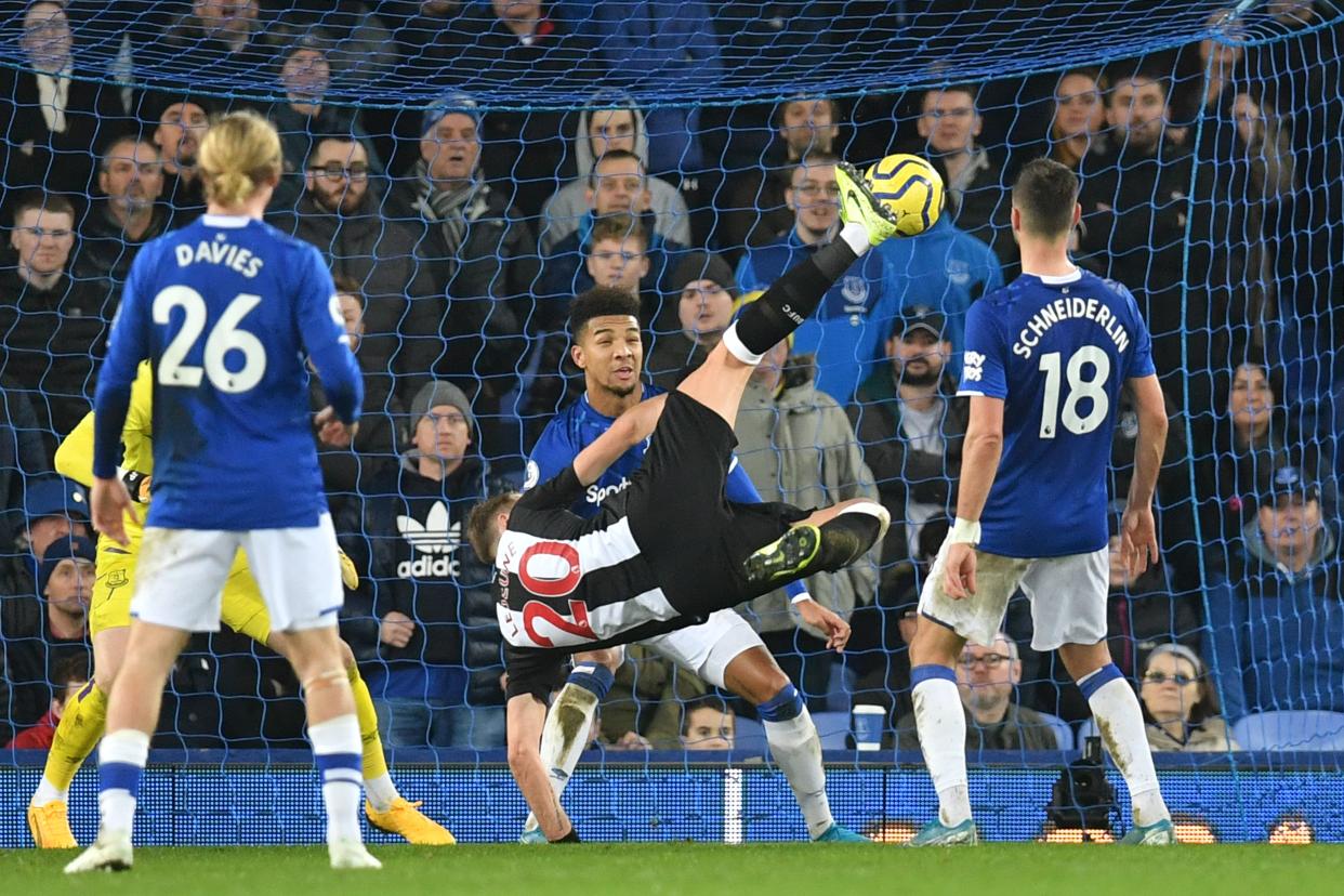 Newcastle's Florian Lejeune (20) scores the first of his two goals against Everton on Tuesday. (Photo by PAUL ELLIS/AFP via Getty Images)