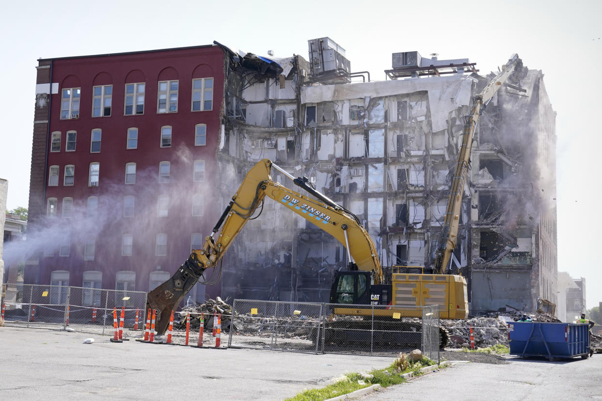 Demolition begins at the site of a building collapse on June 12, 2023, in Davenport, Iowa. (Charlie Neibergall / AP file)