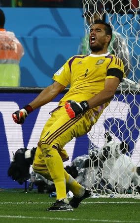 Argentina's goalkeeper Sergio Romero celebrates saving the match deciding penalty in their 2014 World Cup semi-finals against Netherlands at the Corinthians arena in Sao Paulo July 9, 2014. REUTERS/Darren Staples