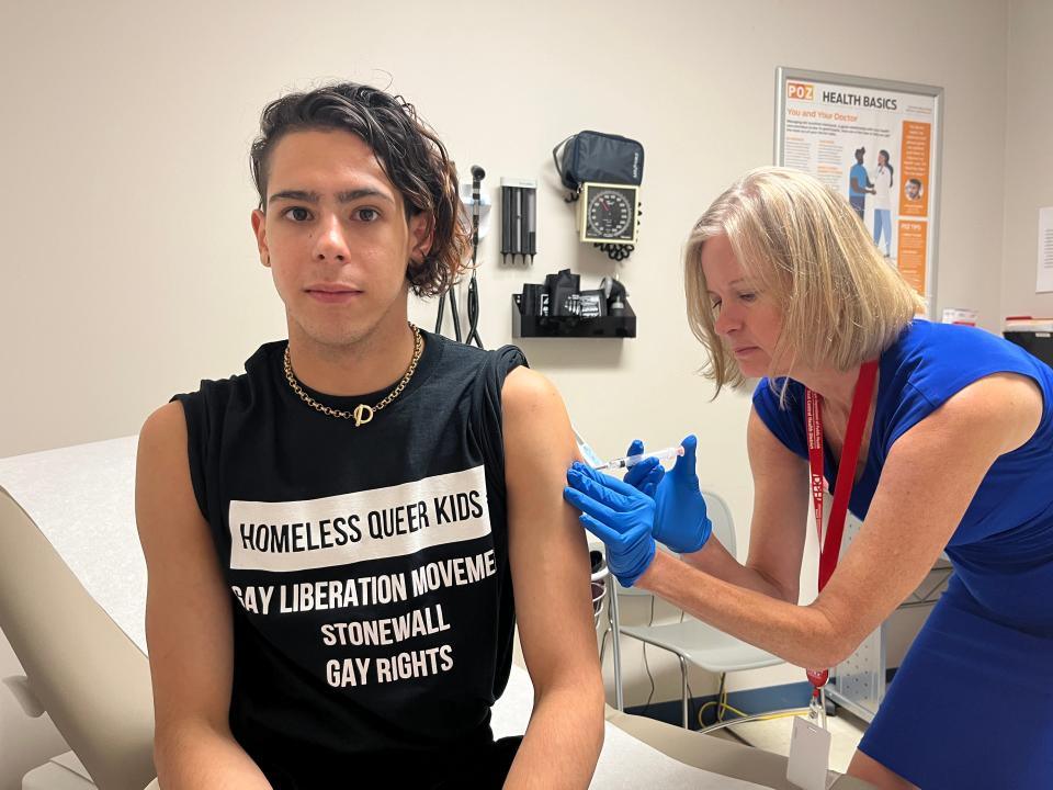 Public health physician Krystn Wagner with the East Central Health District, right, administers a vaccination for monkeypox to Walter Santiago, 26, at the Richmond County Health Department at 950 Laney Walker Boulevard in Augusta, GA, on August 15, 2022.