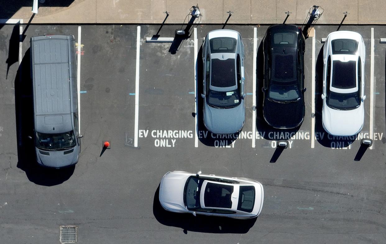 A Polestar electric car prepares to park at an EV charging station on July 28, 2023, in Corte Madera, California.