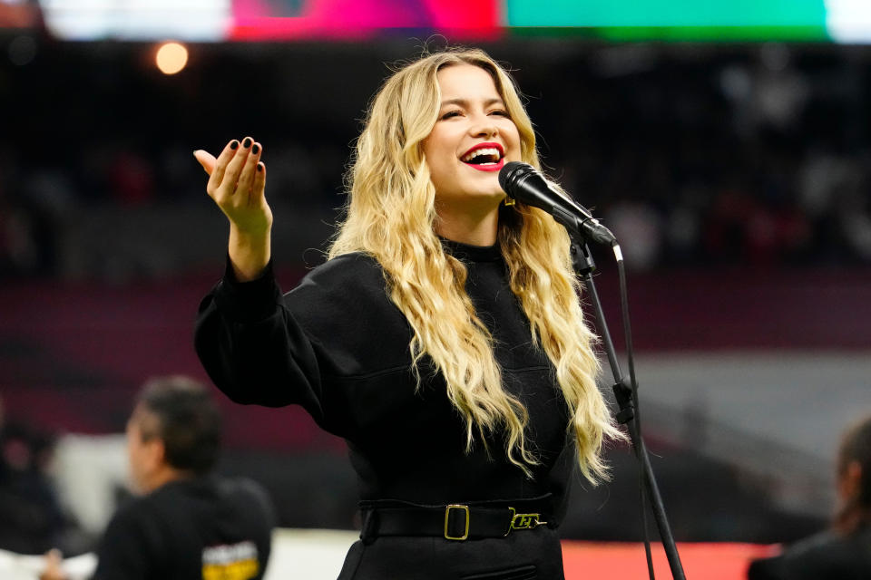 Nov 21, 2022; Mexico City, MEX; Sofía Reyes sings the Mexican national anthem prior to the game between the Arizona Cardinals and the San Francisco 49ers at Estadio Azteca. Mandatory Credit: Rob Schumacher-USA TODAY Sports