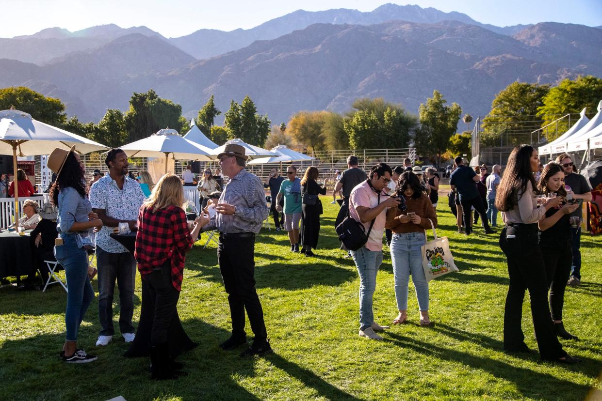Guests enjoy their time at the Inaugural Palm Springs Wine & Food Experience at Palm Springs Stadium in Palm Springs, Calif., Saturday, Nov. 19, 2022. 