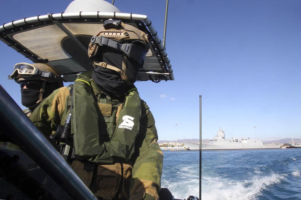 A member of the Norwegian Special Forces looks on during a sea patrol around a Norwegian frigate that docked at Limassol, December 14, 2013. A Danish-led task force was being readied in Cyprus on Saturday to remove the first part of Syria's deadly chemical stockpile, due before the end of this year. Under a deal worked out between the United States and Russia, Syria will relinquish control of deadly toxins which can be used to make sarin, VX gas and other lethal agents. Denmark and Norway plan to use two cargo vessels to transport the cargo out of the Syrian port city of Latakia, escorted by two frigates of their respective navies, and deliver it to the Organisation for the Prohibition of Chemical Weapons (OPCW) for destruction. REUTERS/Andreas Manolis (CYPRUS - Tags: MILITARY POLITICS)