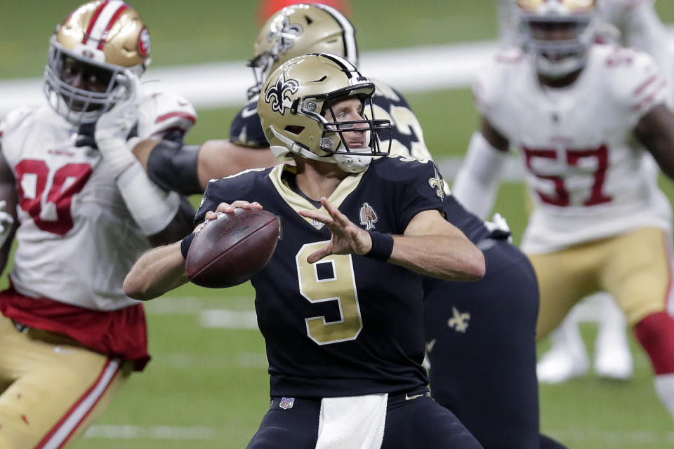 New Orleans Saints quarterback Drew Brees (9) passes in the first half of an NFL football game against the San Francisco 49ers in New Orleans, Sunday, Nov. 15, 2020. (AP Photo/Brett Duke)