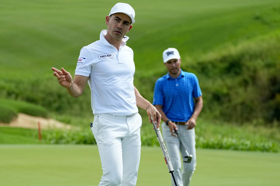 Camilo Villegas acknowledges the gallery on the 18th green during the first round of The Sentry golf event, Thursday, Jan. 4, 2024, at Kapalua Plantation Course in Kapalua, Hawaii. (AP Photo/Matt York)