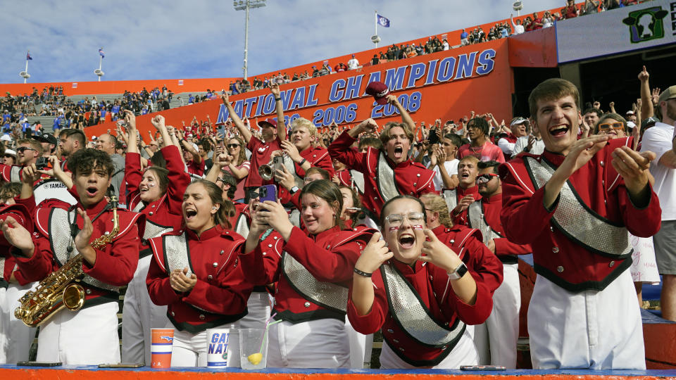 Arkansas band members celebrate after their team defeated Florida in an NCAA college football game, Saturday, Nov. 4, 2023, in Gainesville, Fla. (AP Photo/John Raoux)