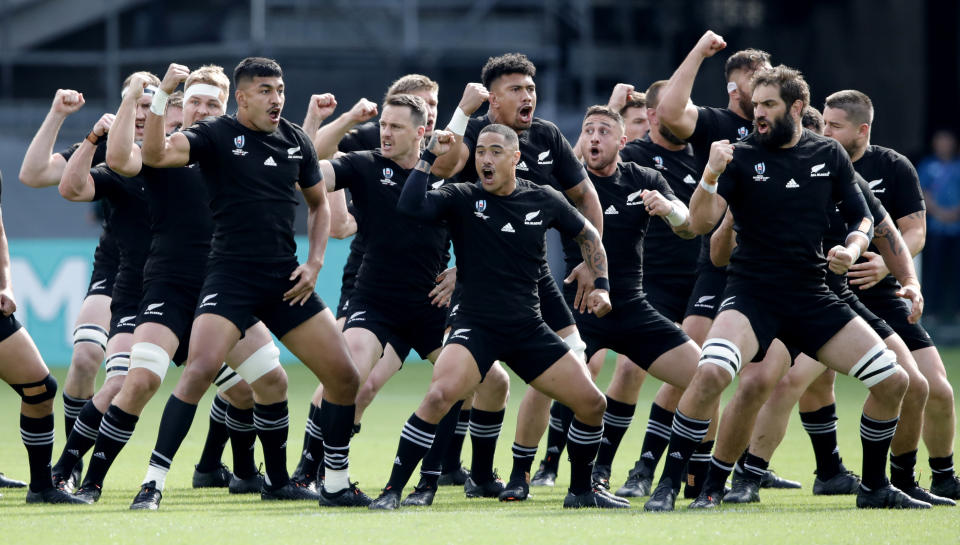 The All Blacks perform the haka ahead of the Rugby World Cup Pool B game at Tokyo Stadium between New Zealand and Namibia in Tokyo, Japan, Sunday, Oct. 6, 2019. (AP Photo/Christophe Ena)