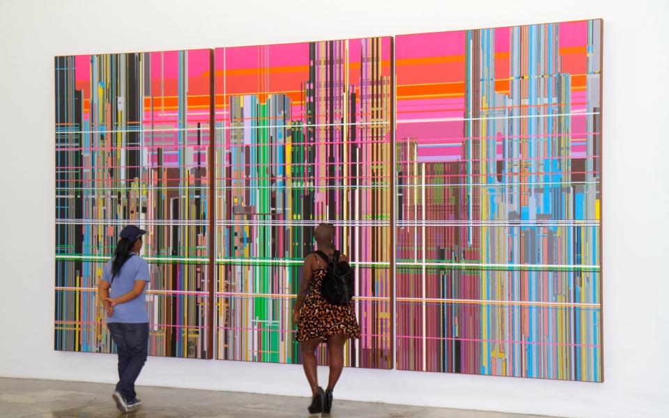 two people looking at colourful modern art - Jeff Greenberg 