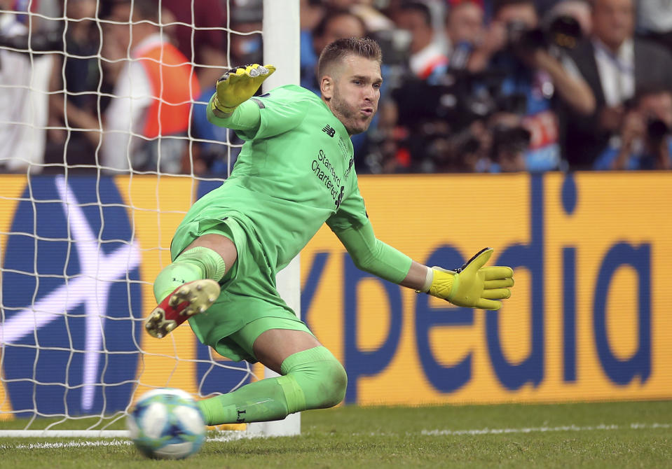 Liverpool's goalkeeper Adrian stops a penalty shot from Chelsea's Tammy Abraham during the UEFA Super Cup soccer match between Liverpool and Chelsea, in Besiktas Park, Thursday, Aug. 15, 2019. (AP Photo)