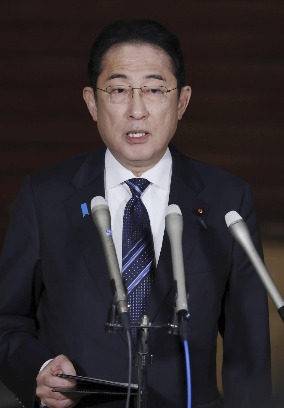 Japan's Prime Minister Fumio Kishida speaks to the reporters at his office in Tokyo following an earthquake Monday, Jan. 1, 2024. Japan issued tsunami alerts and told people to evacuate seaside areas after a series of strong quakes on its western coastline Monday. (Kyodo News via AP)
