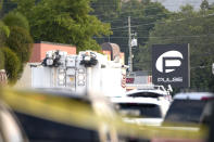 <p>Police cars and emergency vehicles surround the Pulse Orlando nightclub, the scene of a fatal shooting, in Orlando, Fla., Sunday, June 12, 2016. (AP Photo/Phelan M. Ebenhack) </p>