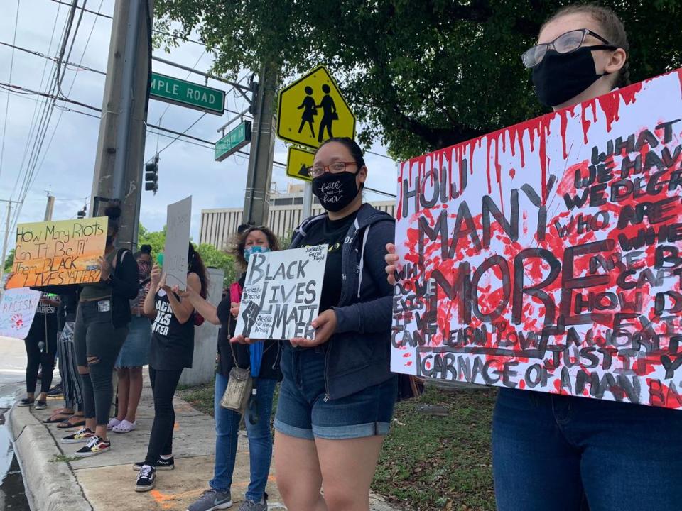 Demonstrators gathered outside the Coral Springs City Hall building on Tuesday, June 2, 2020.